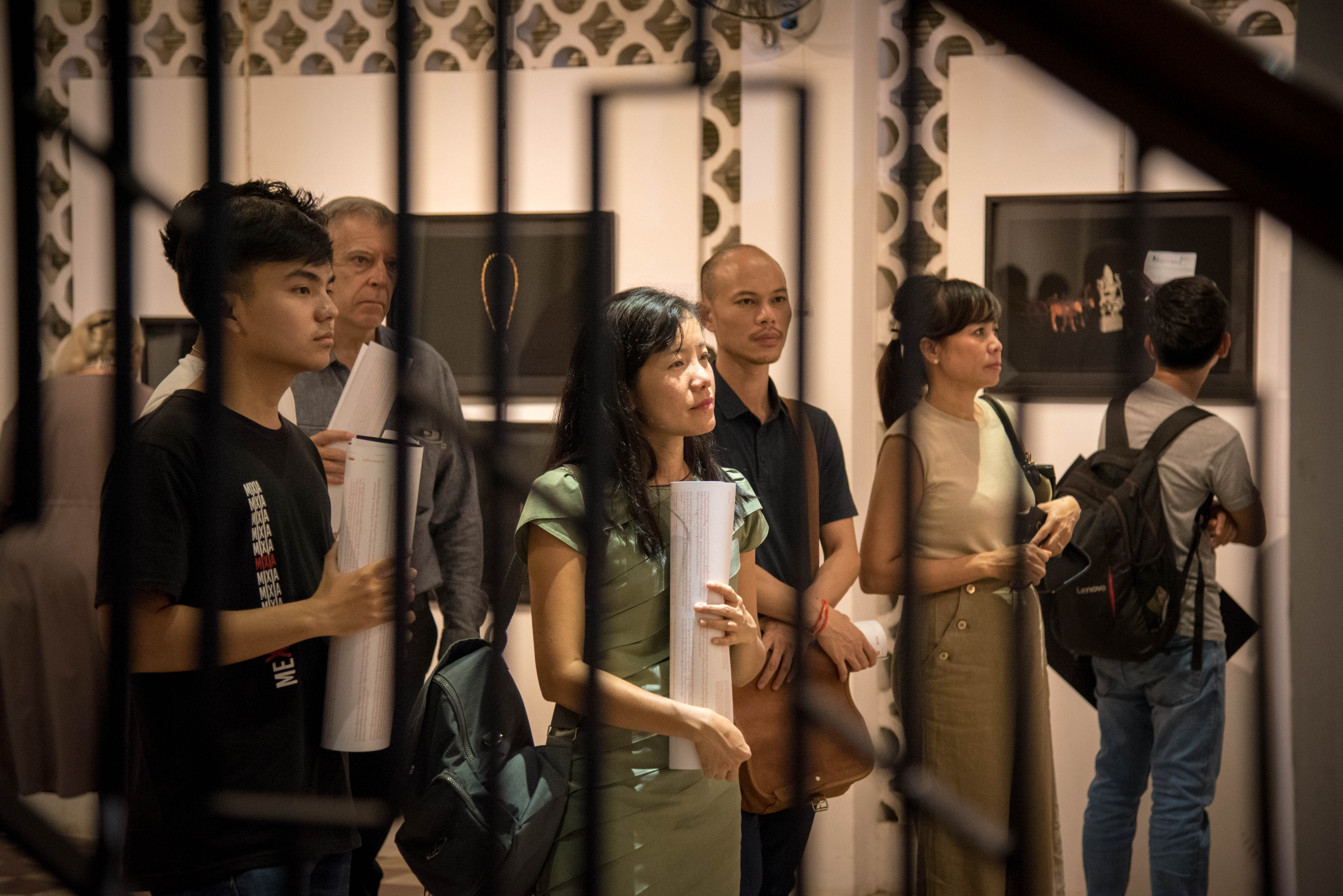 Slider Image People viewing Kim Hak's Alive exhibition at Bophana Center