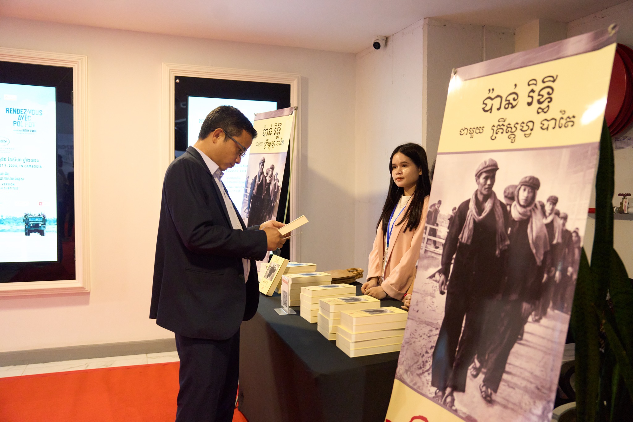 Sales of Rithy Panh's book Elimination at its launch event. Photo credit: Bophana Audiovisual Center.