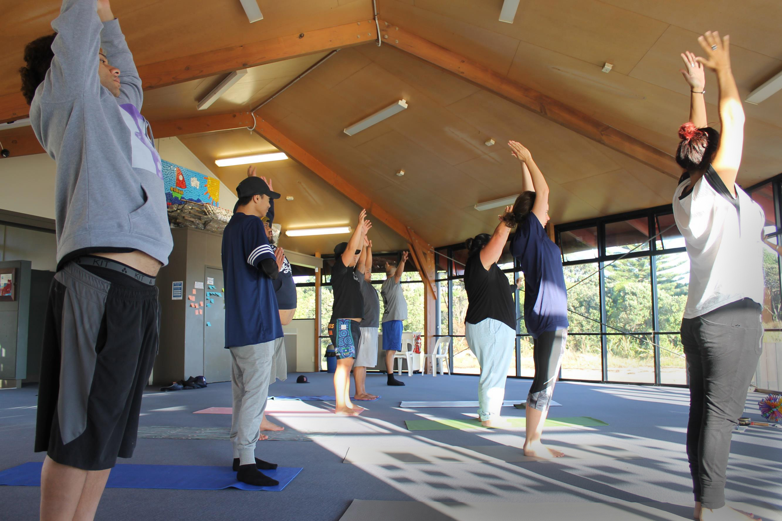 Slider Image Campers are led in a yoga class.