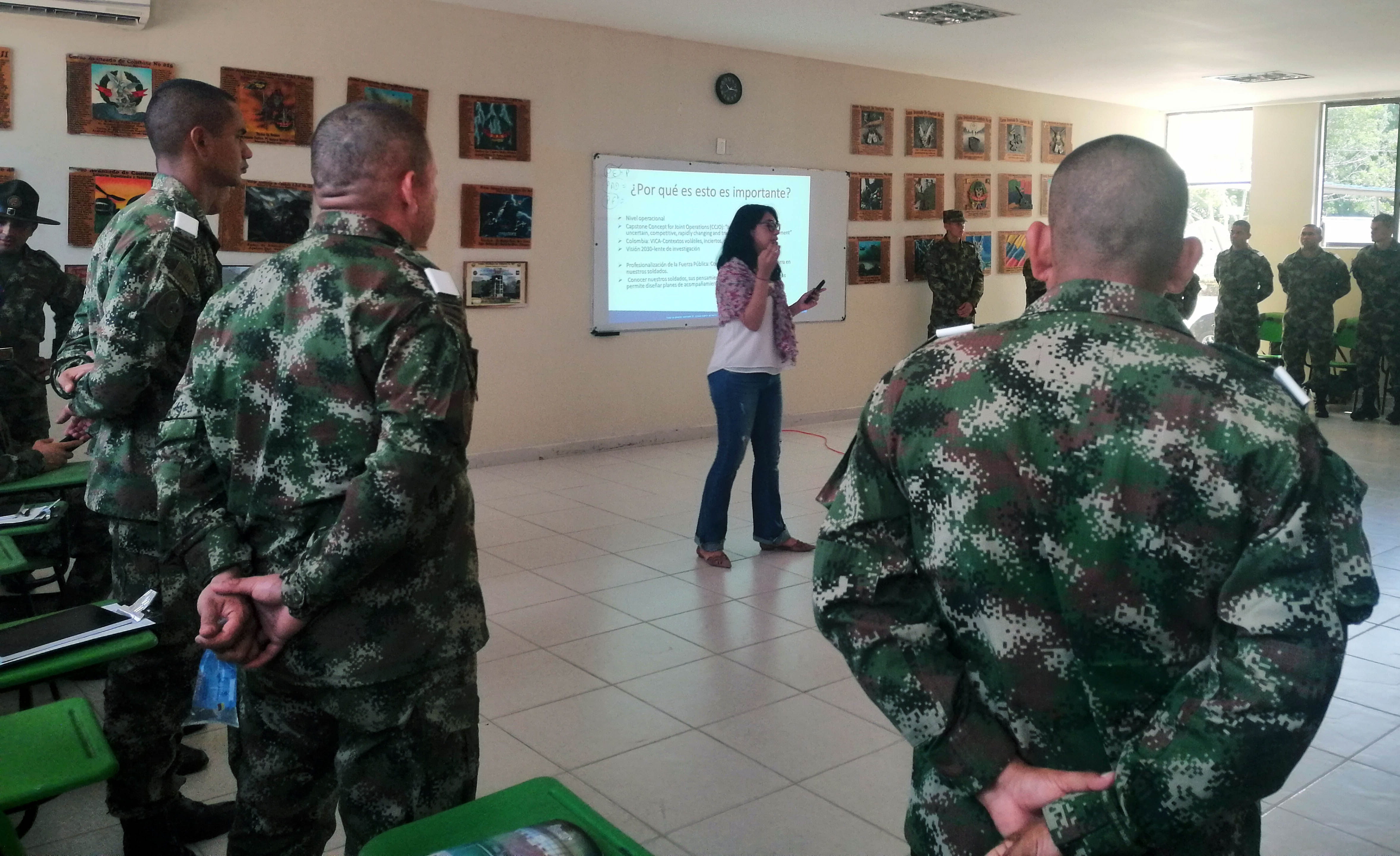 Slider Image Rei Foundation scholar Alejandra Del Pilar Ortiz-Ayala works with soldiers from the state army in Colombia.