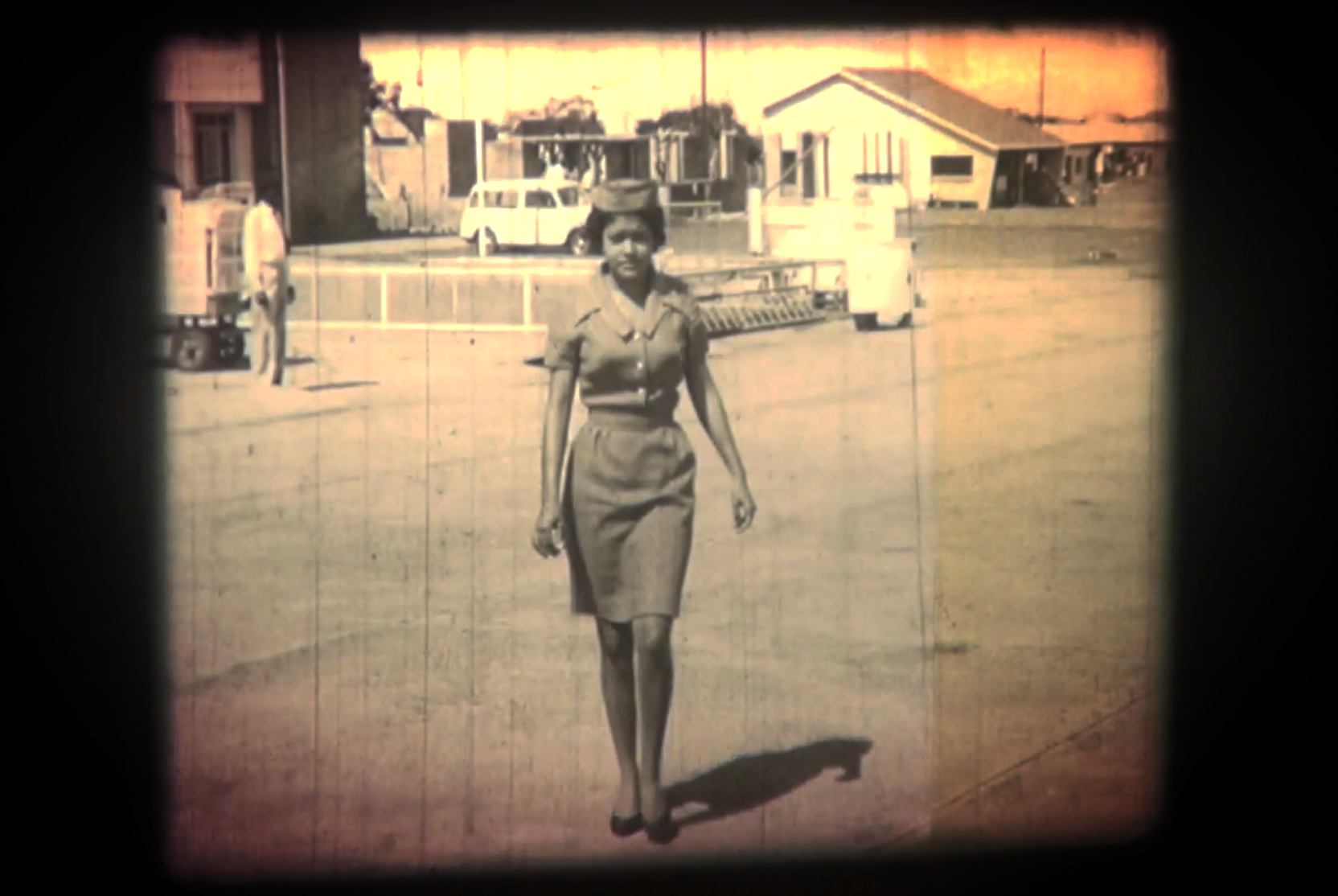 Slider Image A flight attendant, featured in early footage of a presidential visit.